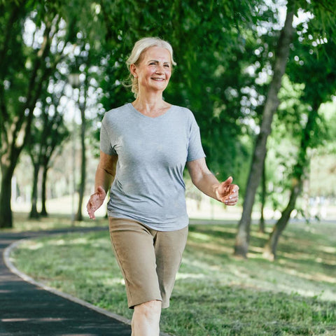 Older woman racewalking outdoors
