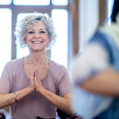 Older woman in a yoga class