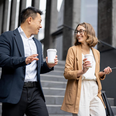 Man and woman office workers walking to work