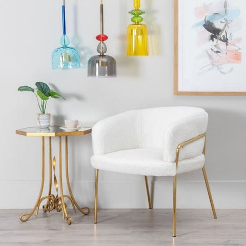 Polar white armchair with gold legs and gold metal coffee table