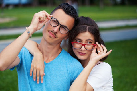 couple posing where blue light blocking glasses