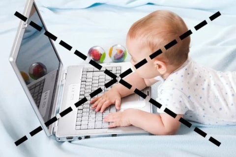 baby on computer with big cross through image. recommended screen time not for babies