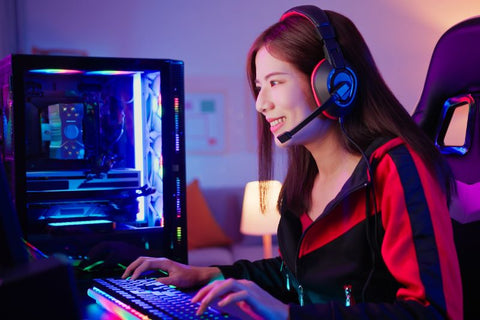 girl playing video game in front of a beautiful rgb light