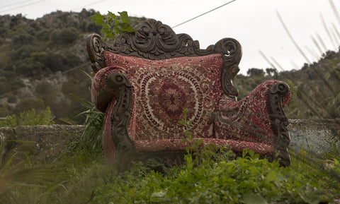 old stuffed chair in the grass