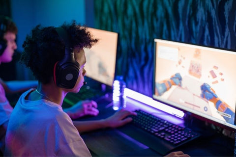 Young gamer concentrating on a screen