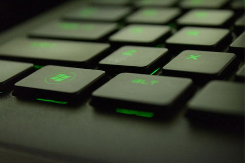 a black keyboard with green backlight