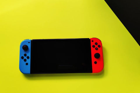 nintendo switch on yellow and black background