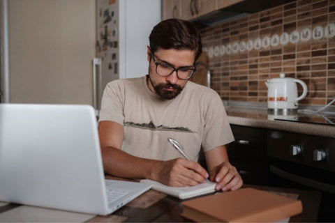 man wearing blue light glasses all the time in the kitchen