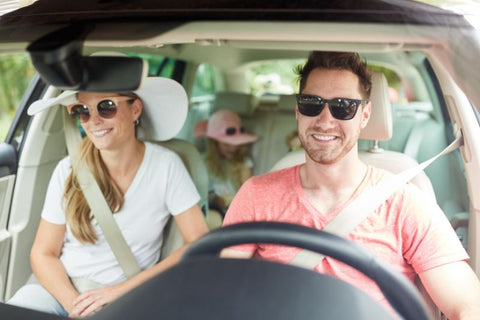 family in car, driving while wearing sunglasses