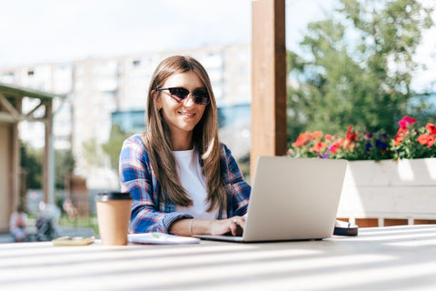 girl with sunglasses at computer
