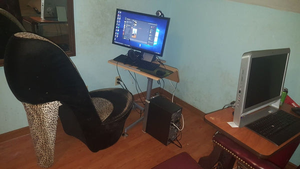 horrible gaming setup with even worse gaming chair