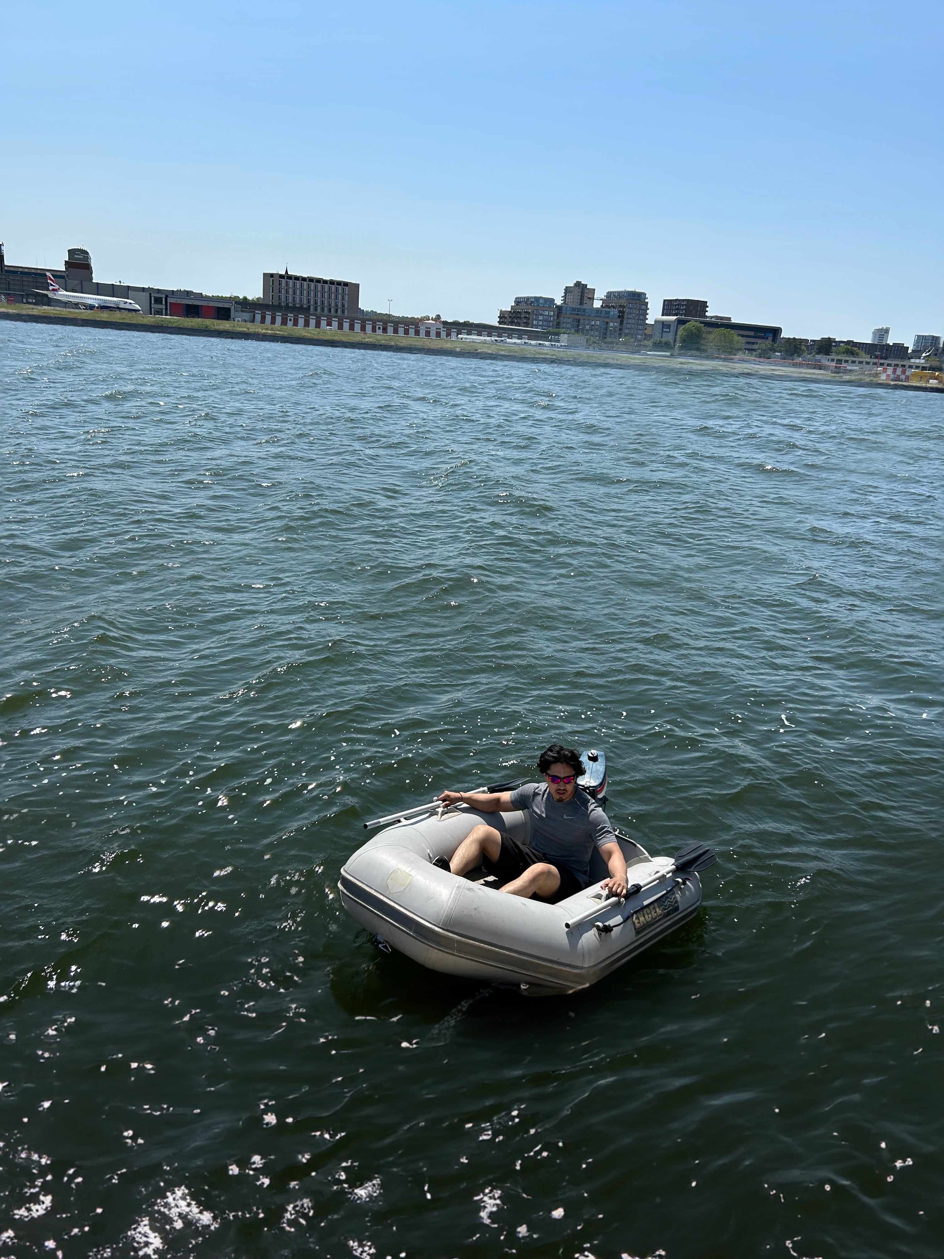 Man in Mini Boat