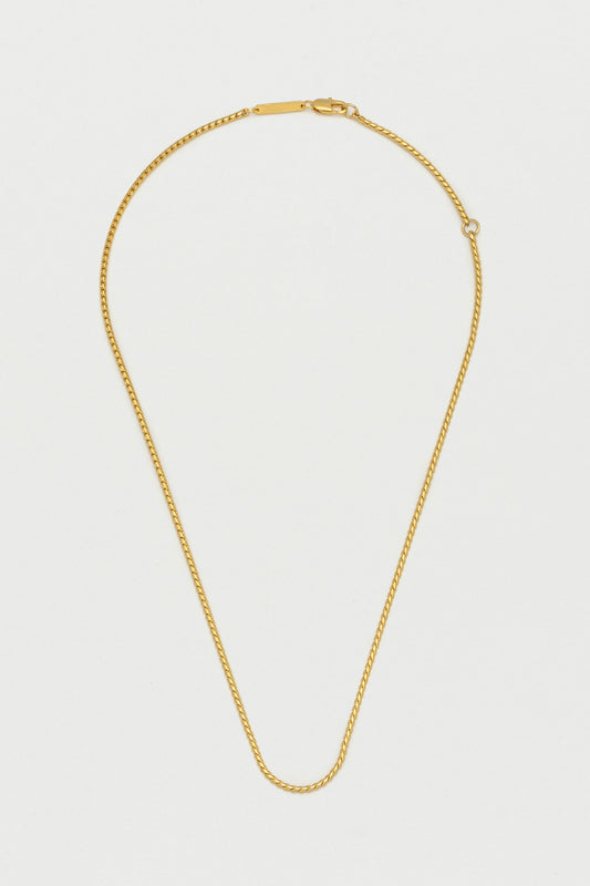 Gold-plated metal pendant set with a lapis lazuli baguet…