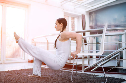 Woman stretching on a chair