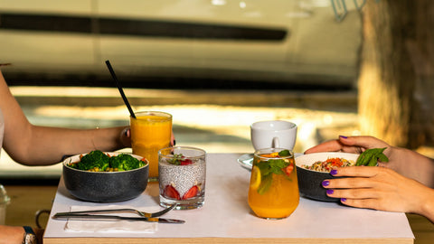 Women at table with healthy food