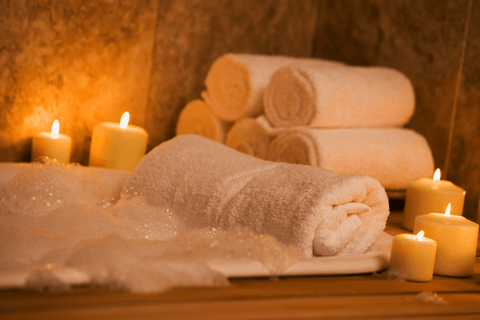 Bathtub with candles and towels