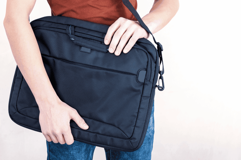 man holding a laptop bag graduation gift