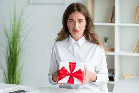 woman disappointed by a gift received at the office
