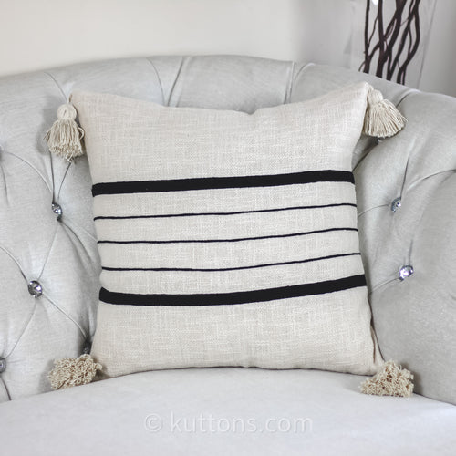 https://cdn.shopify.com/s/files/1/0602/2394/6948/products/HandmadeTexturedCottonStripedPillowCover-LargeCornerTassels-1_500x.jpg?v=1668736101