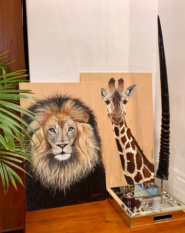 Lion and giraffe on wood