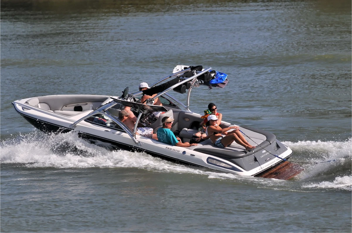 Group relaxing on speedboat in water