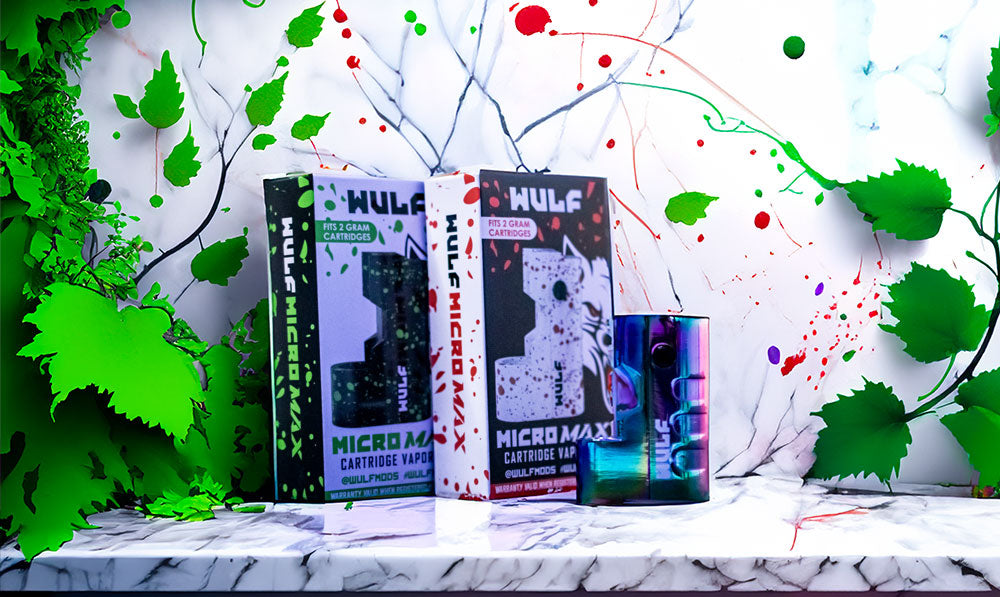 Wulf Micro Max packaging and full color device standing on white marble counter with greenery and splatter colors