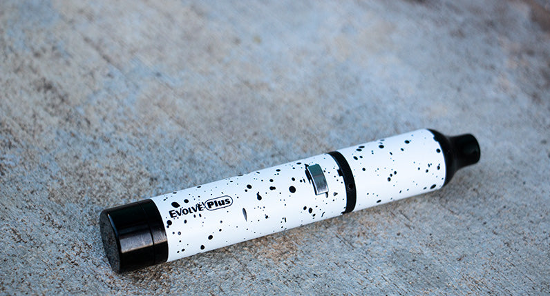 Wulf Evolve Plus White with Black Spatter laying down on ground