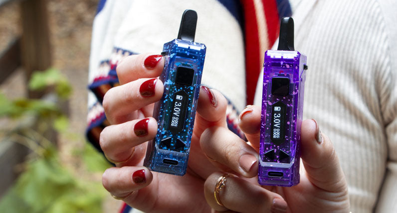 Two women holding Wulf X-Ray UNI Pro in front of park setting