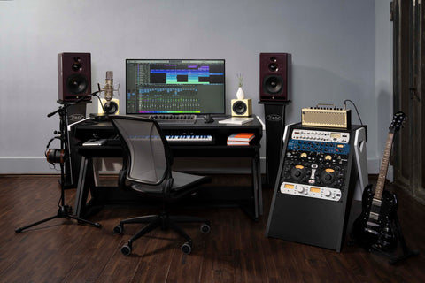 A compact setup desk with key trolley, rack and speaker stands for content creators at large