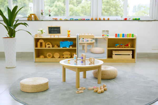 Early Years Furniture In The Middle Of An Early Years Center With Wooden Toys Surrounding