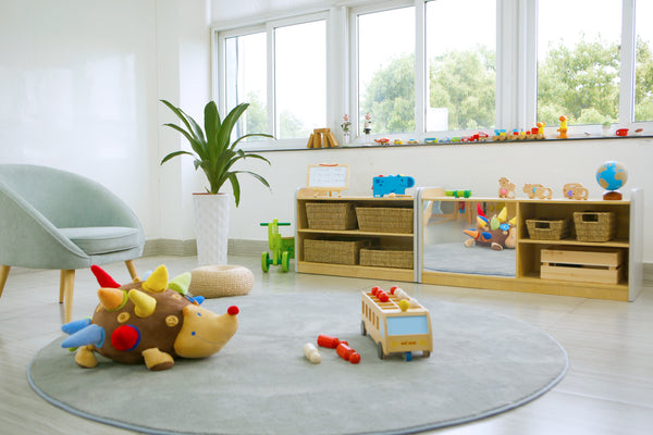 Early Years Furniture In An Early Years Center With Shelves And Toys Surrounding