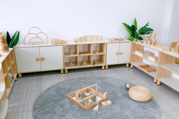 Shelves Holding Toys With A Rug In An Early Years Center