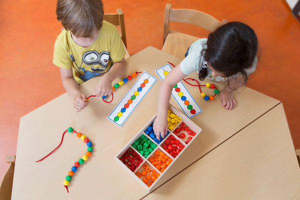 Two Children Playing With Educo Toy To Increase Creativity
