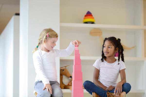 Young Girls Playing With Montessori Resource