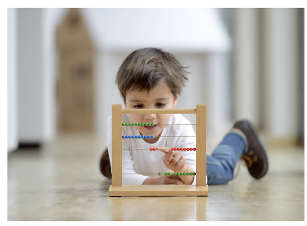 Child Playing With Montessori Resources