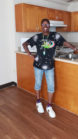 black woman smiling standing in kitchen