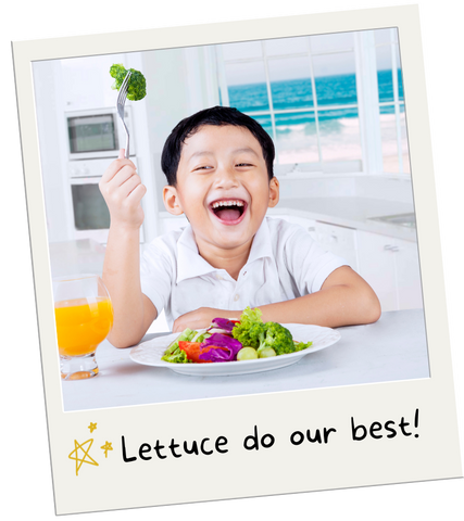 A polaroid of a happy child eating a plate of veggies. The text reads, "Lettuce do our best!"