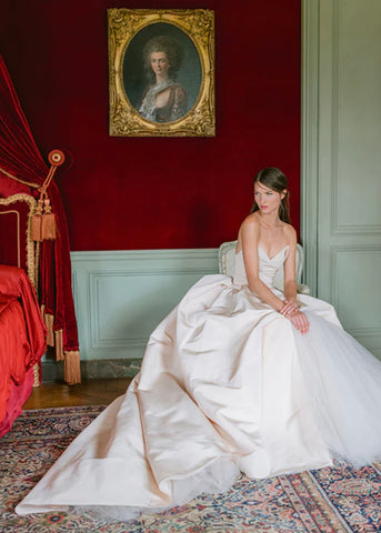 Bride stuns in gold draped Baroque-inspired gown by Vivienne Westwood