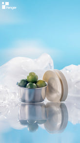 Fenger small stainless steel sauce container with suction cup lid filled with small fresh limes and surrounded by ice
