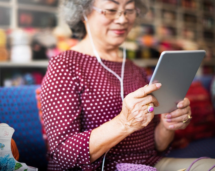 aging woman on ipad