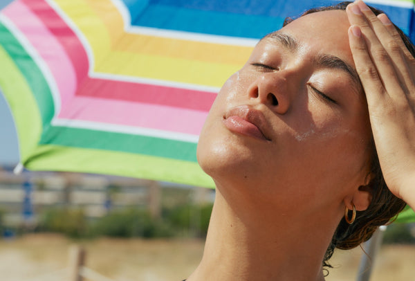 Woman with her face to the sun