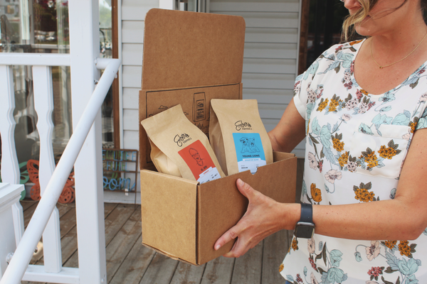 woman holding box subscription