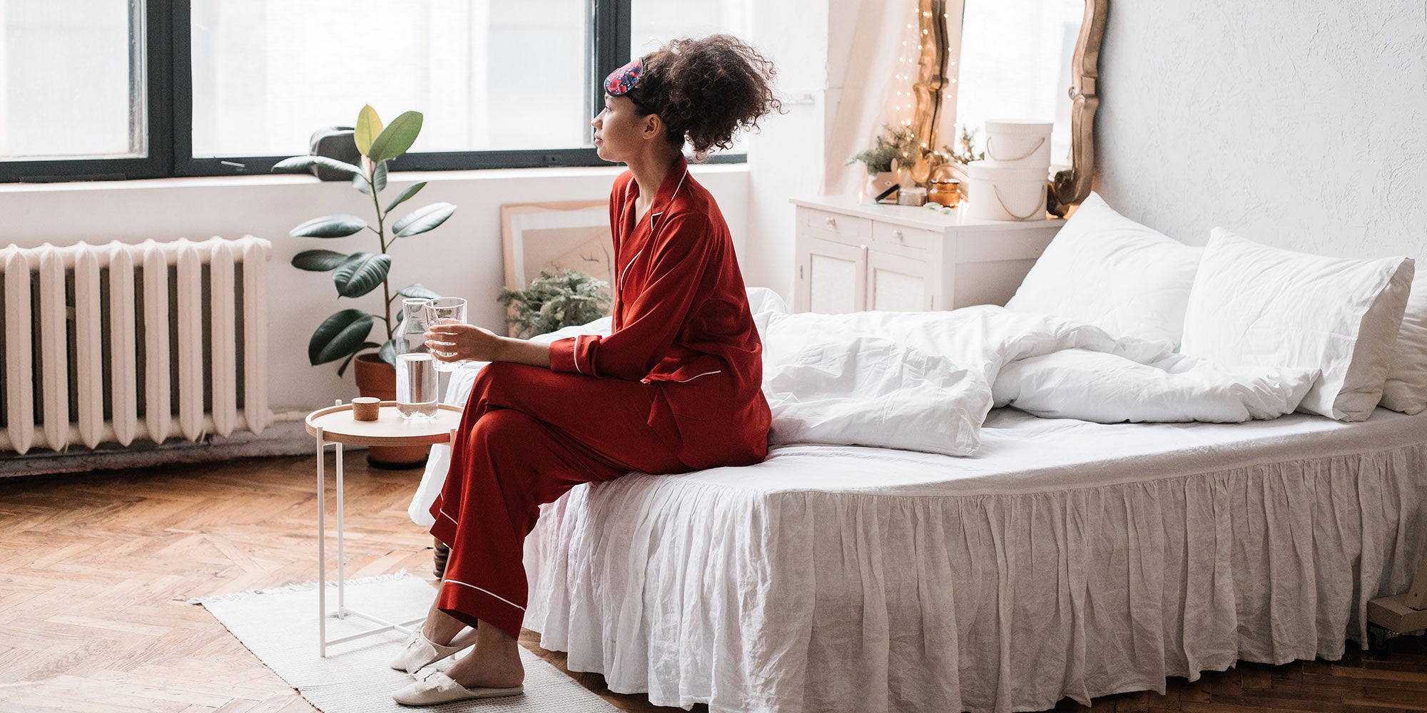 woman-in-red-silk-pajamas-bedroom