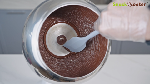 let the chocolate melt, then use the silicone spatula to recycle it into the glass bowl