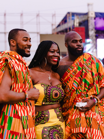 3 friends wearing Kente Traditional Clothing