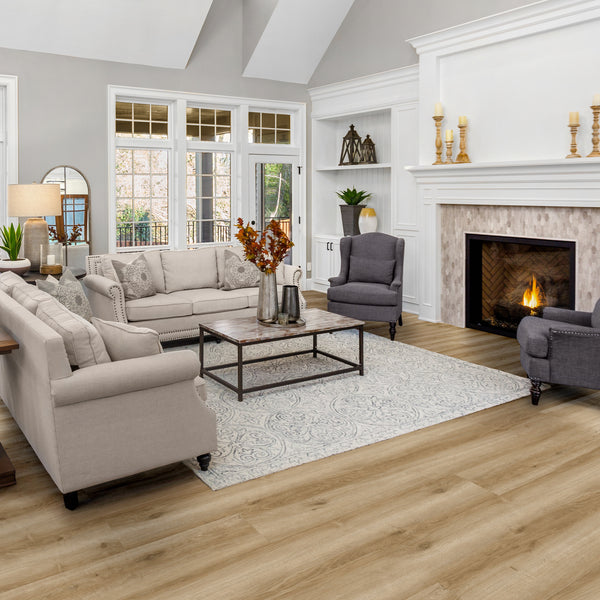 A spacious living room featuring Anza SPC vinyl plank flooring with traditional design elements