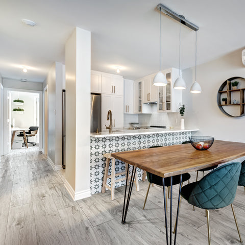 A city apartment designed with pops of color, mix of textures, and continuous vinyl plank floors in Knox