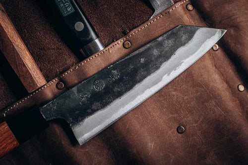 https://cdn.shopify.com/s/files/1/0602/6720/0736/products/kyohei-shindo-blue-2-kurouchi-165mm-bunka-no-handle-383129_500x500.jpg?v=1703401328