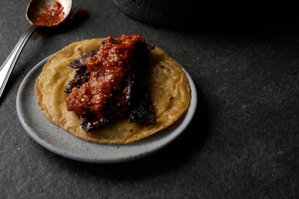 Steak taco with salsa roja