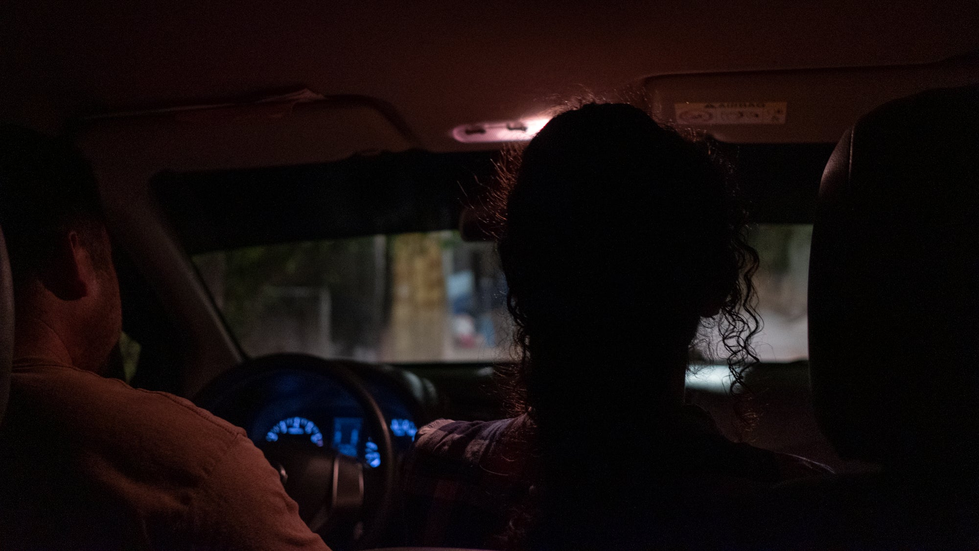 Gabriel, Alma and Alex driving at night. 